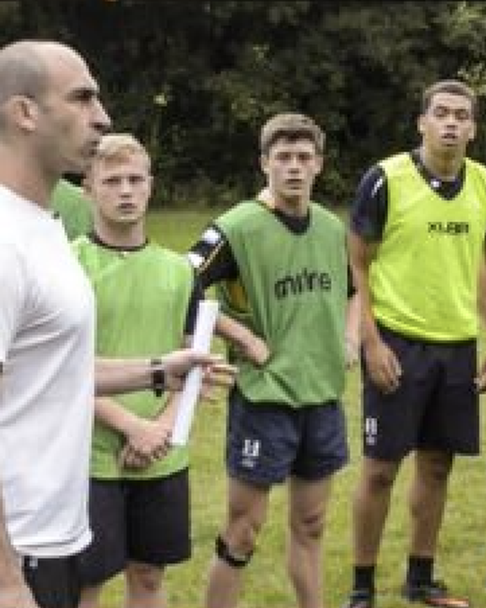 Ben coaching teenage academy players